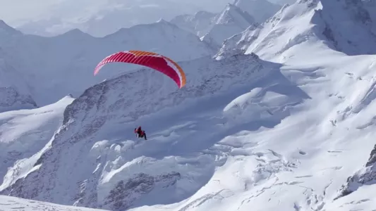 Ueli Steck - Paraglides Between Mountains In The Swiss Alps